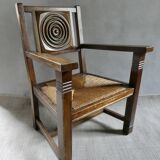 Armchair in carved solid wood with straw seat