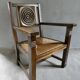 Armchair in carved solid wood with straw seat