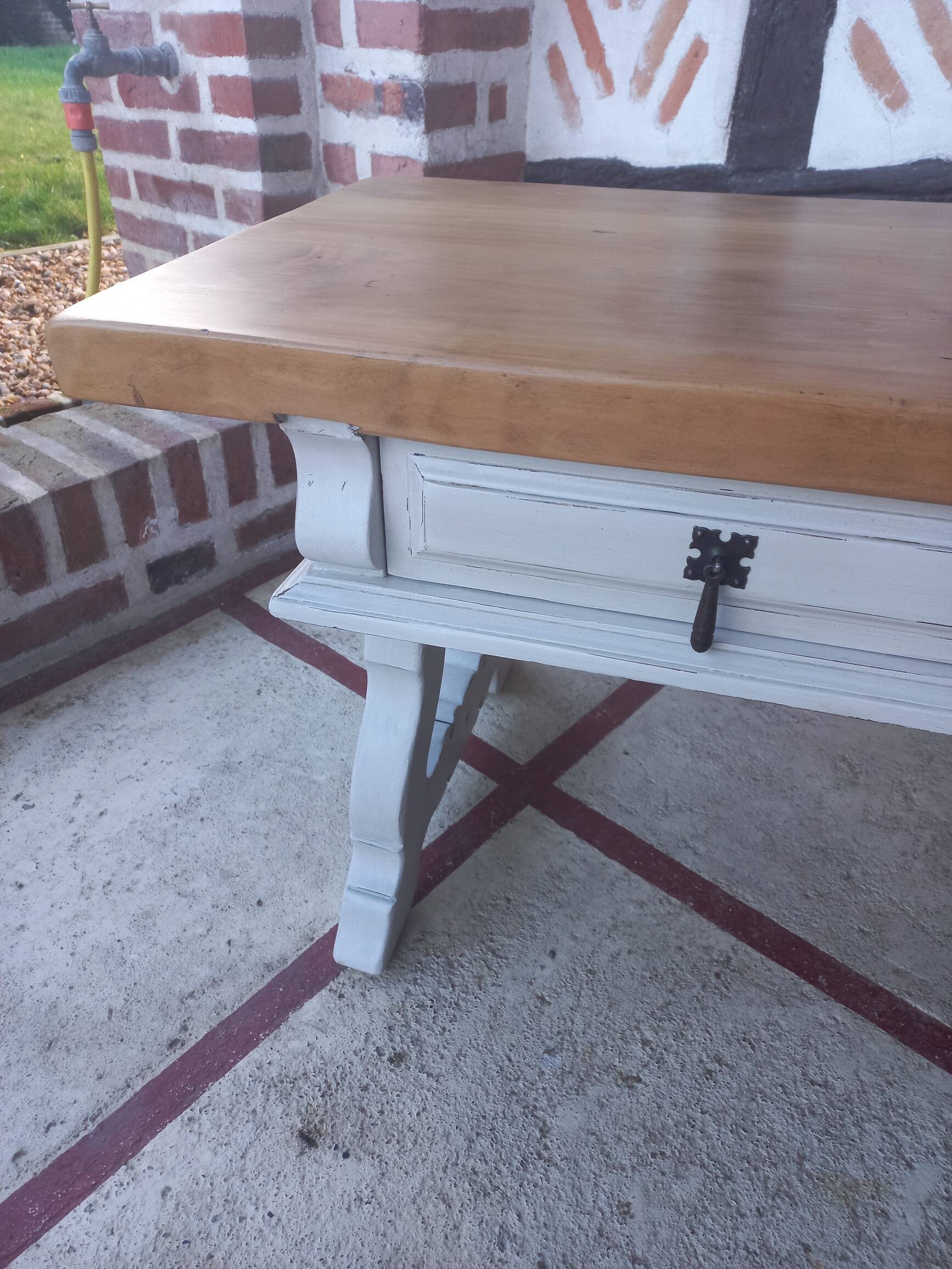 Patinated linen coffee table with raw top