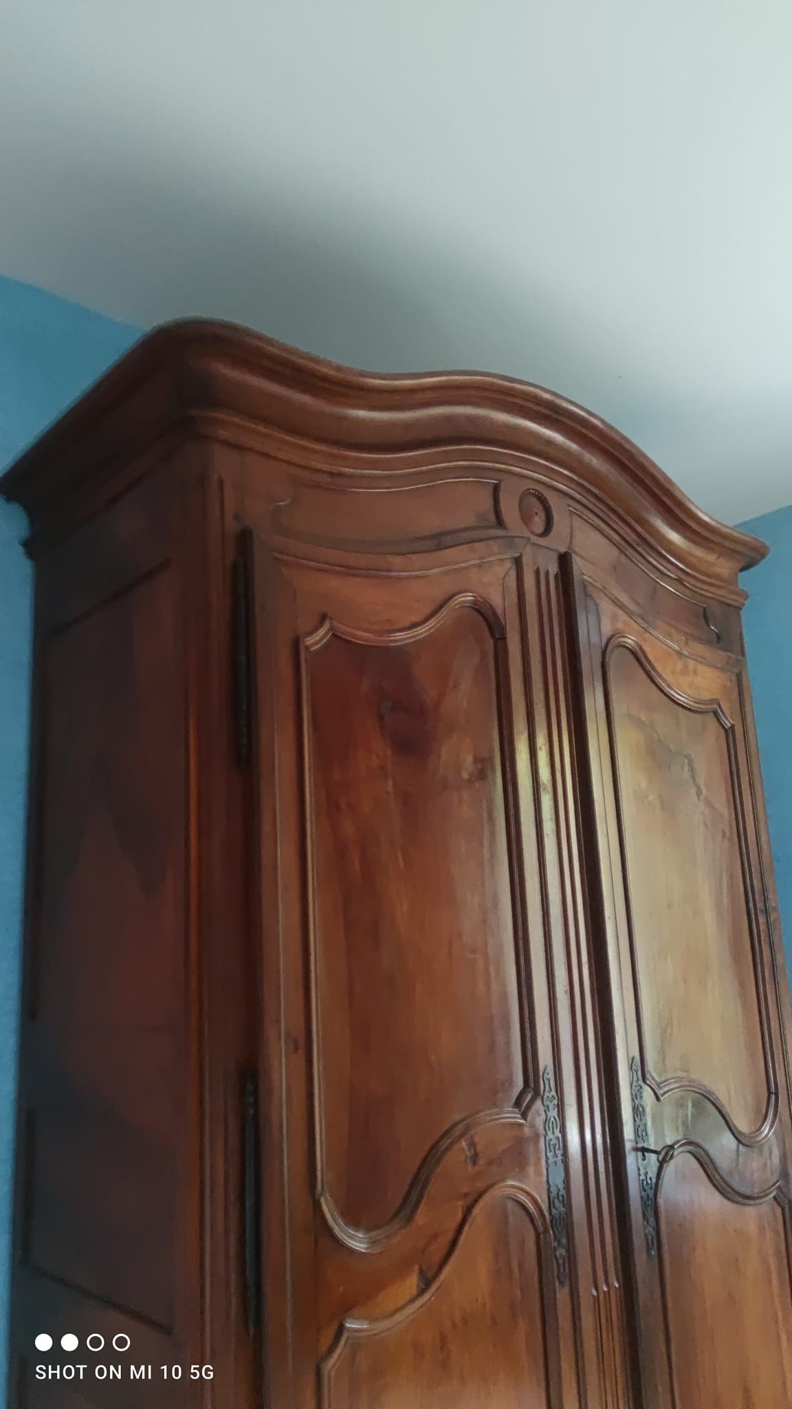 Large Louis XV style gendarme's hat-shaped wardrobe