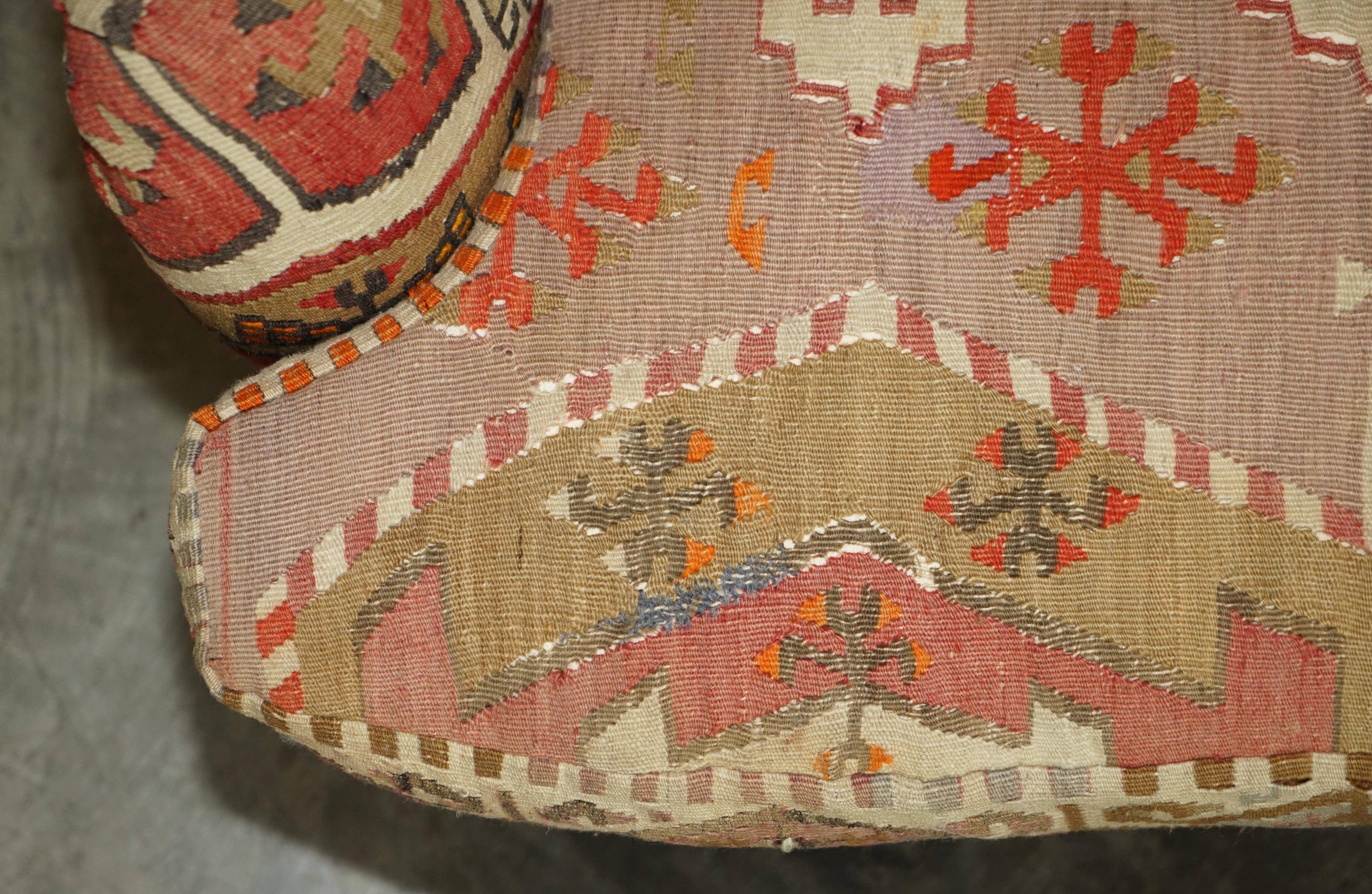 Vintage three-seater canapé by George Smith upholstered in Kilim with feather cushions.