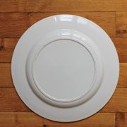 Plat rond en terre de fer décor iris Badonviller