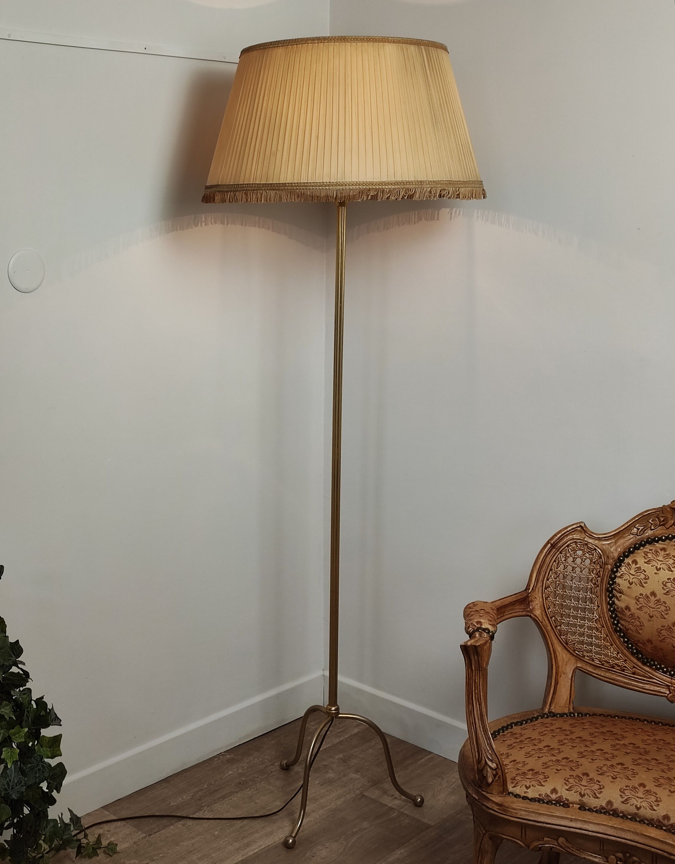Golden tripod floor lamp