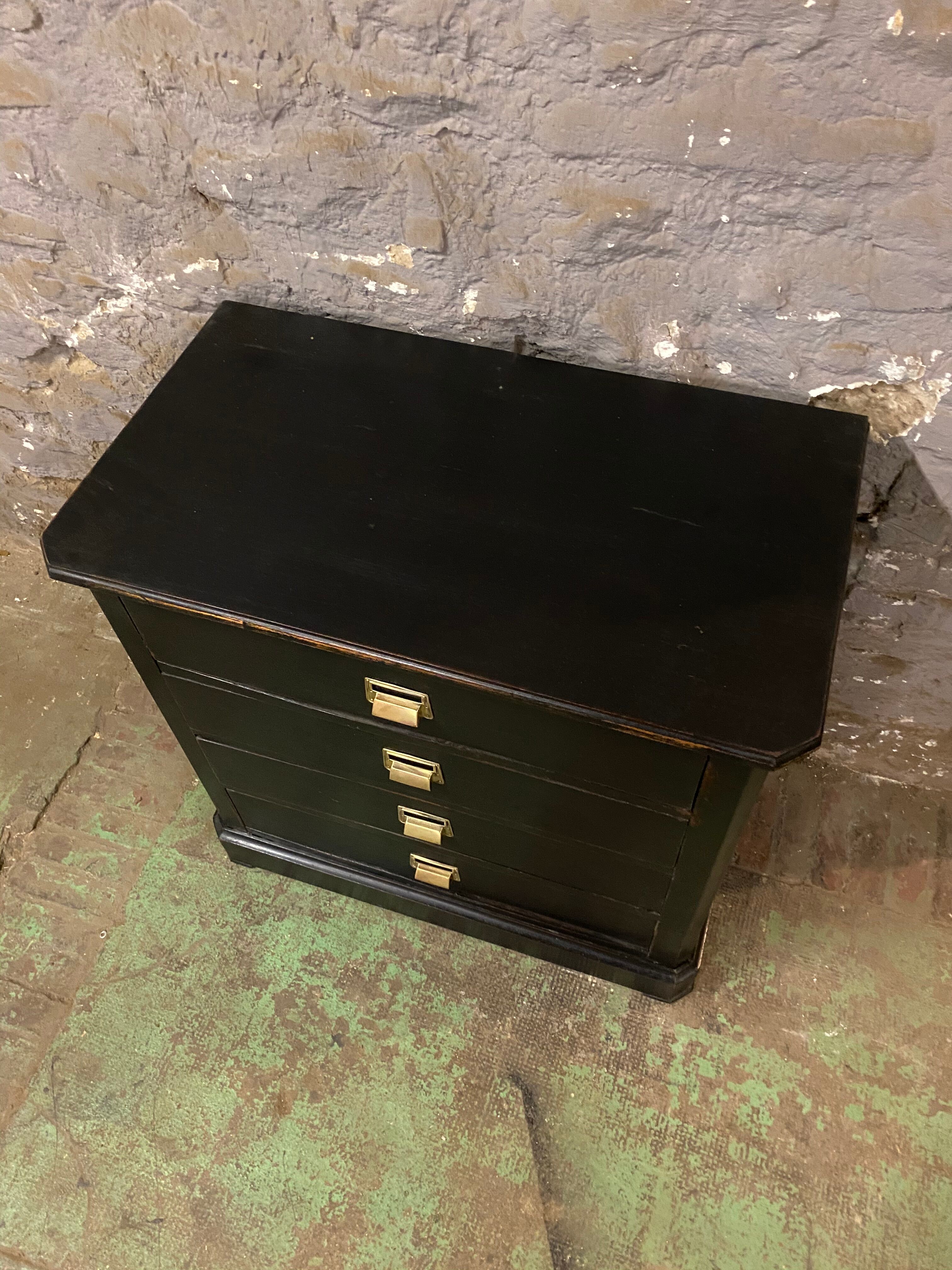 Old black patinated chest of drwers