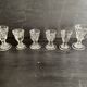 Set of antique liqueur glasses in thick glass, bistro style.
