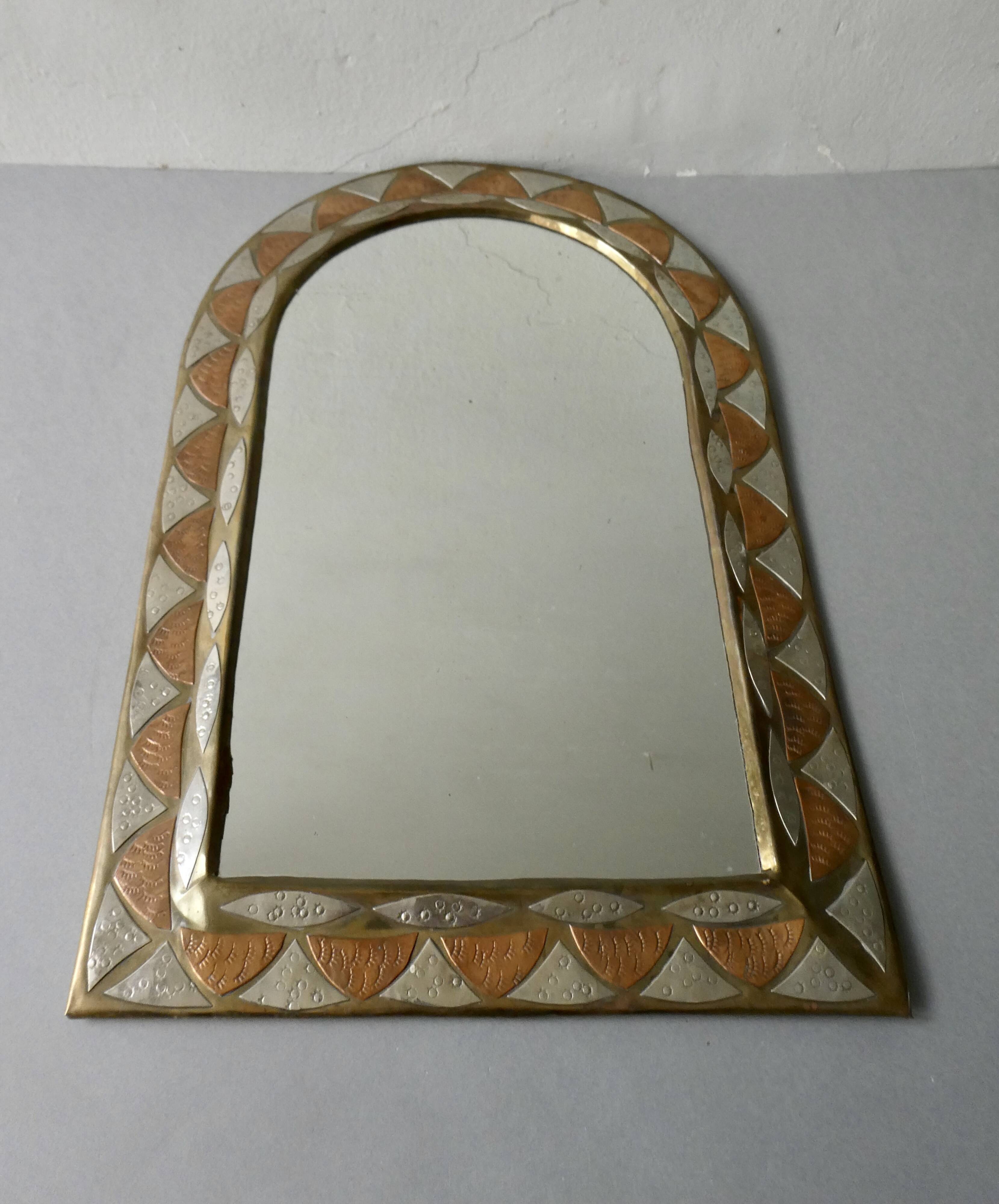 Moroccan mirror in chiseled brass, copper and silver, 70s-80s