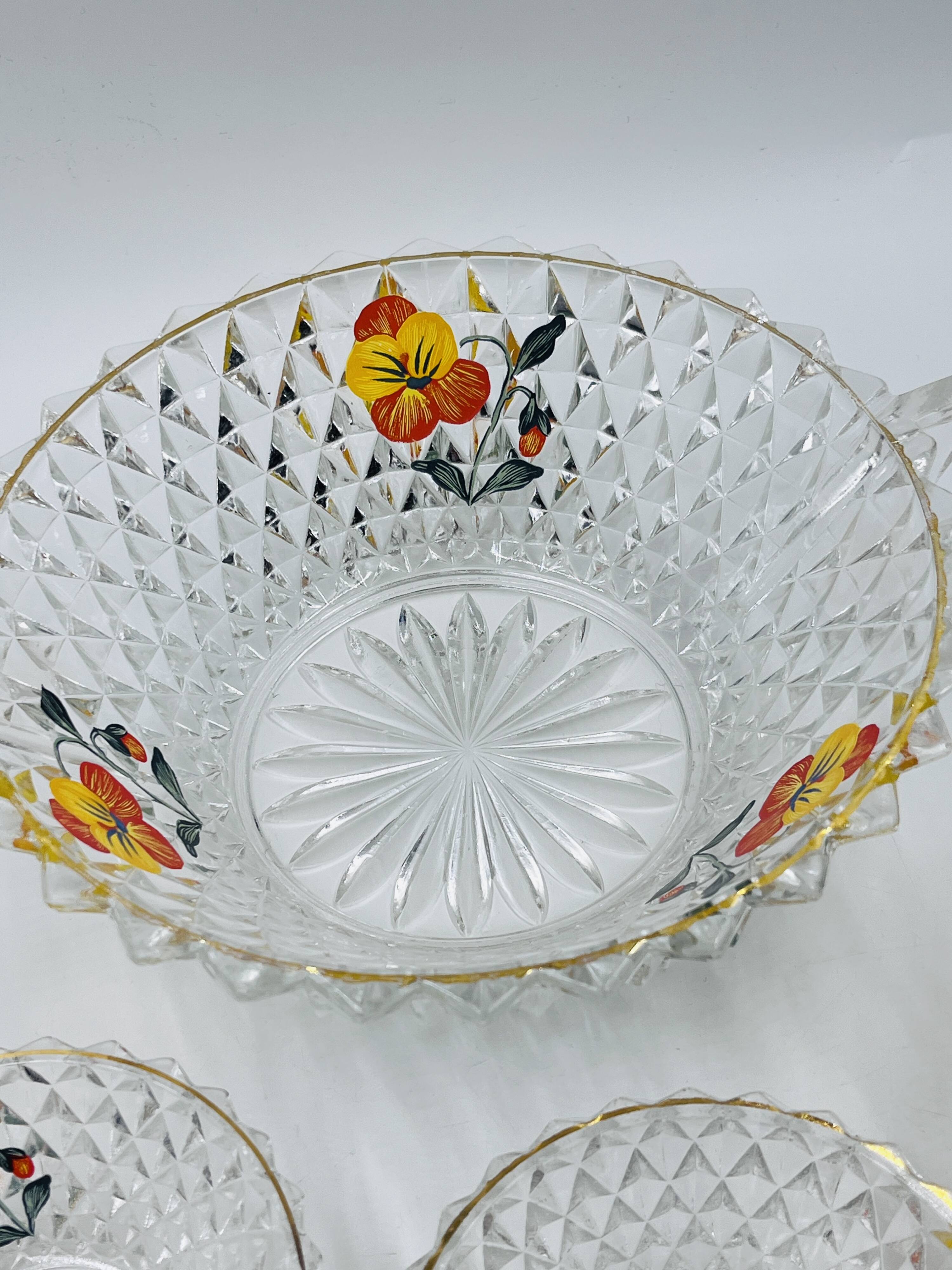 Vintage glass fruit salad serving set with a pansy design.
