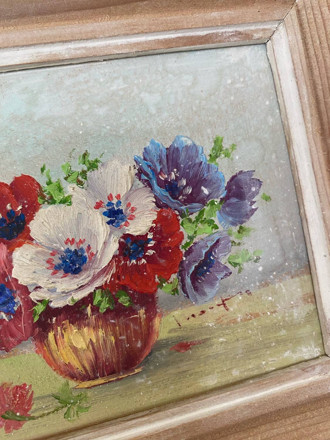Painting bouquet of anemones in a vase.