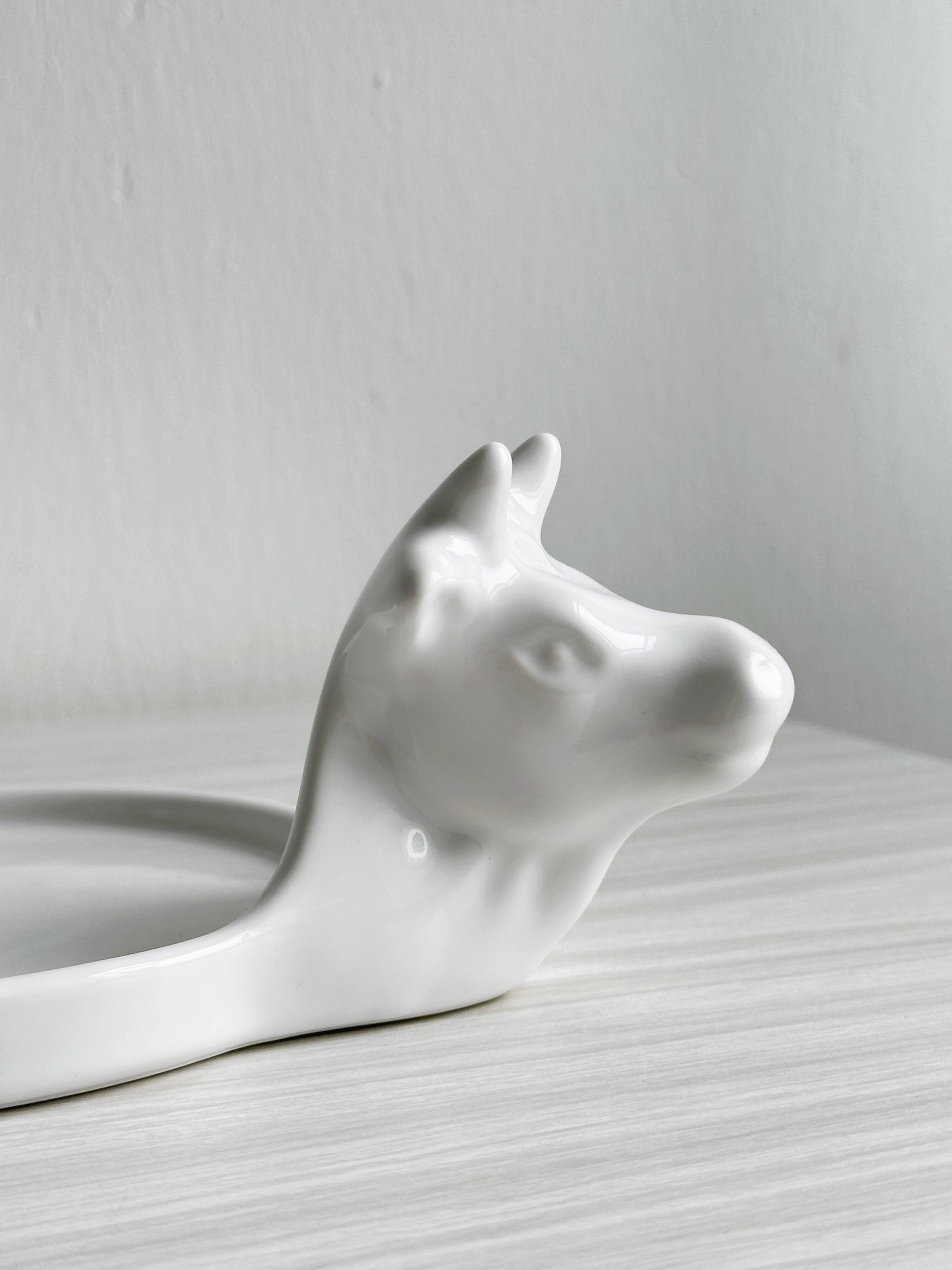 White porcelain cheese dish with handle and cow's head