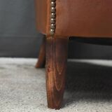 Solange club armchair in sheepskin leather.