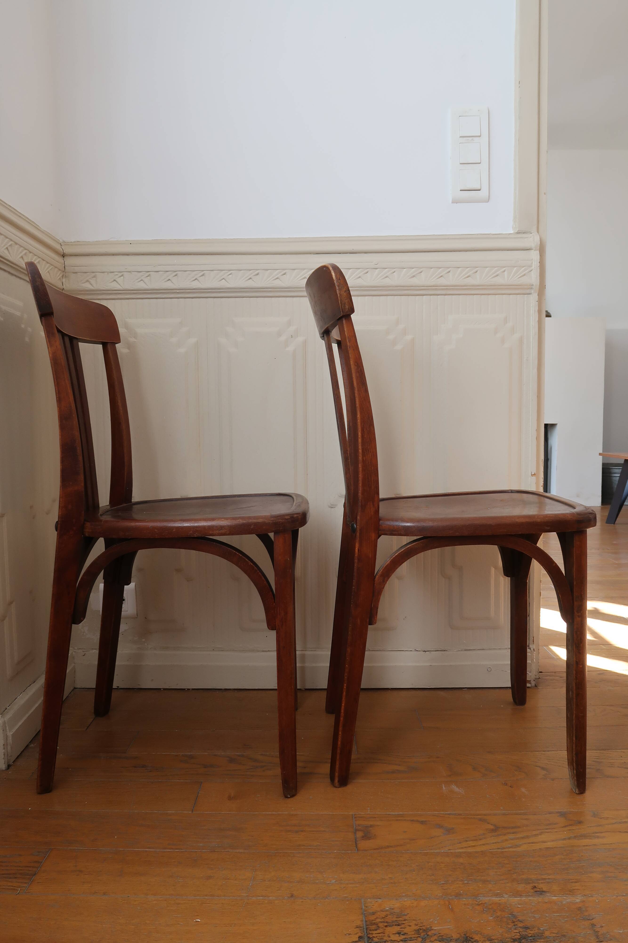 Pair of patinated bistro chairs