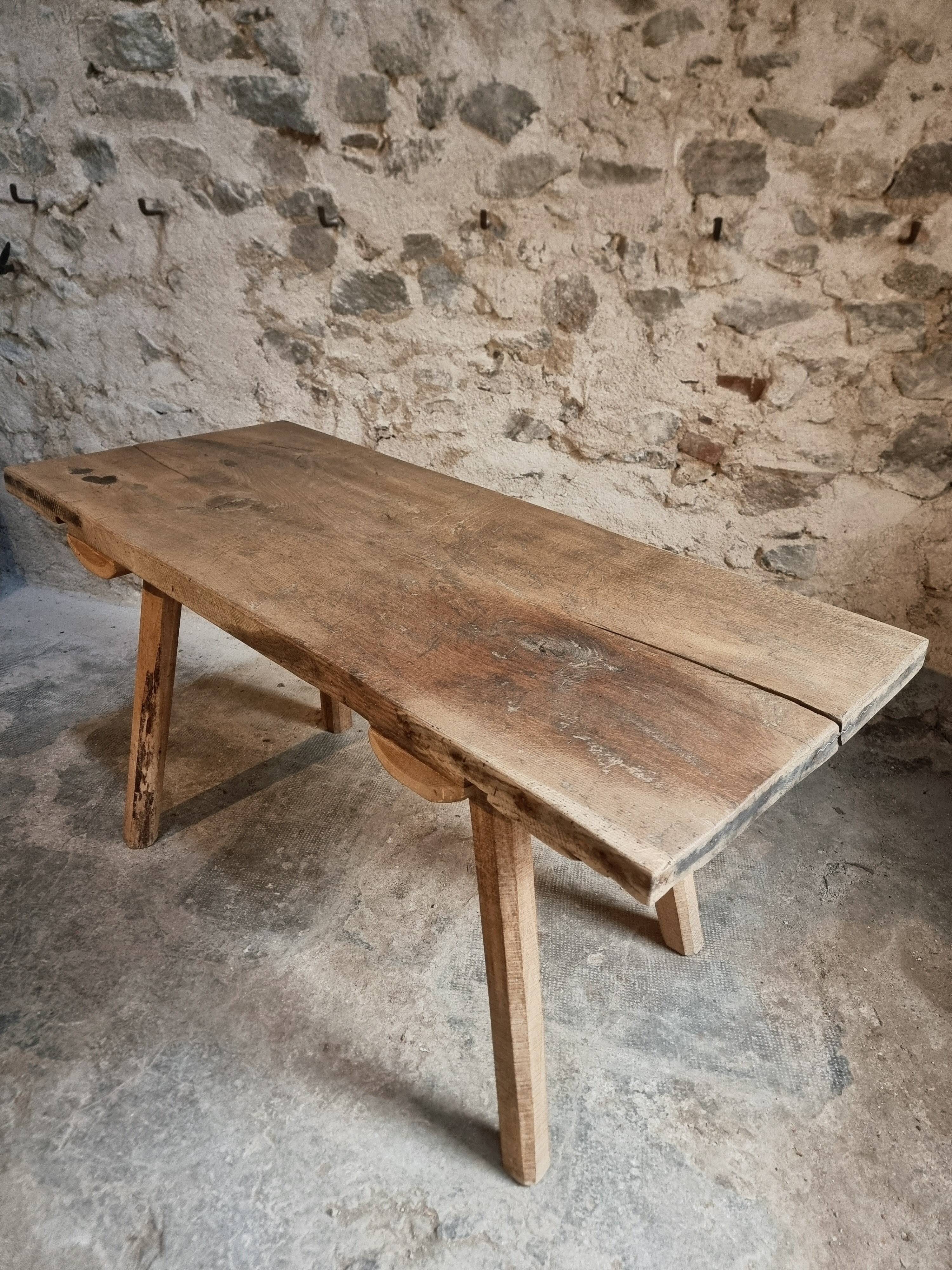 Antique work table / primitive dining table in oak, Hungary, circa 1900–1930.