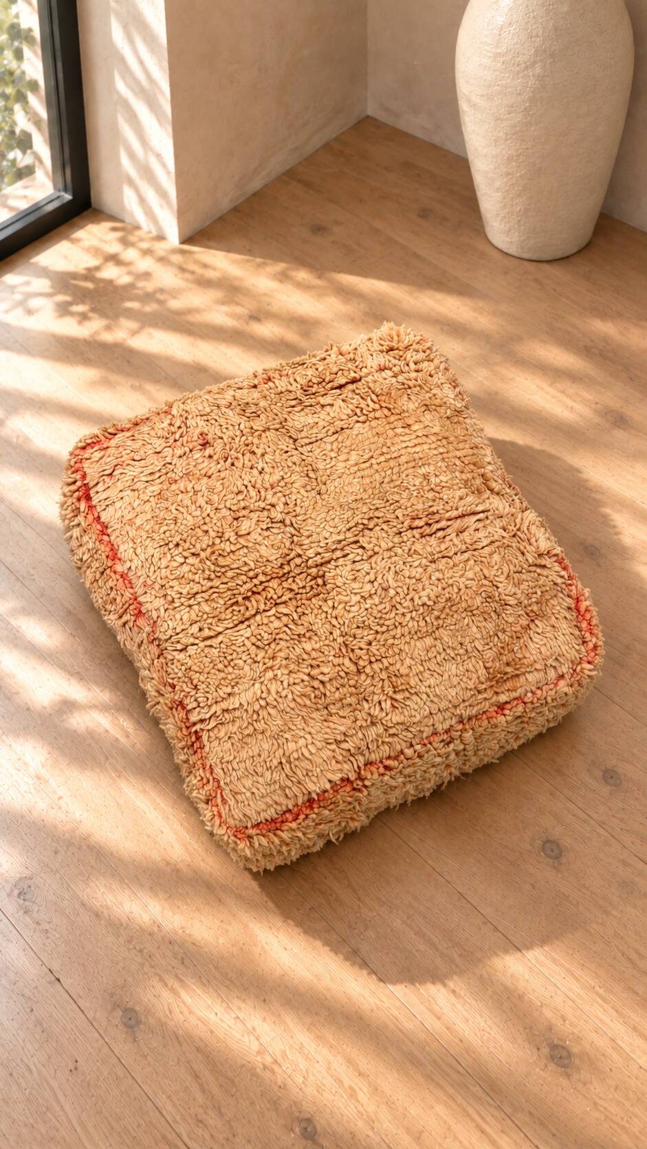 Vintage Berber pouf in natural wool – salmon and beige