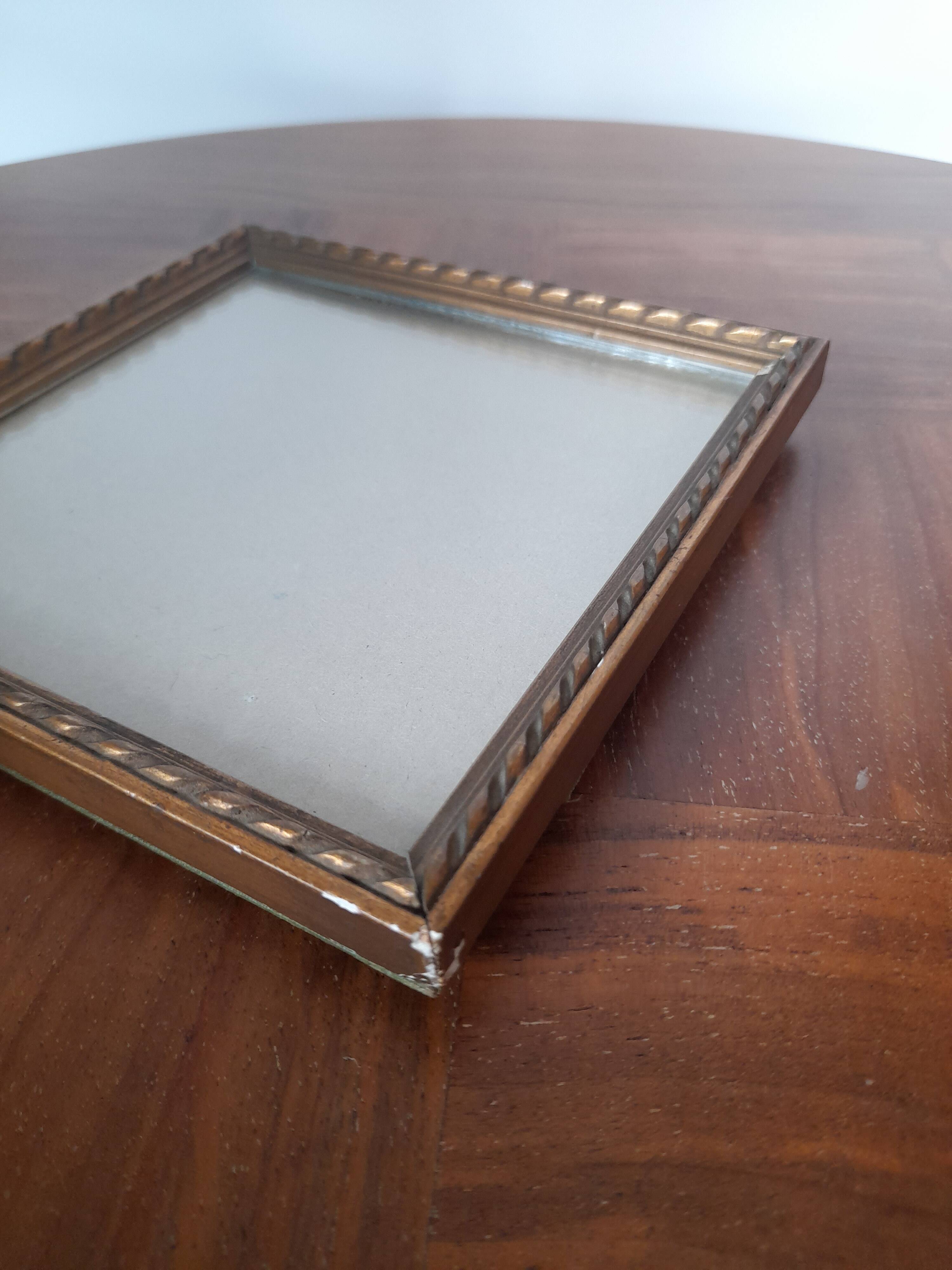 Old square golden frame to place or hang