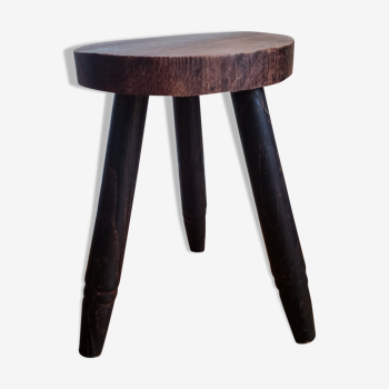 Ancient tripod stool in solid wood