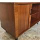 Vintage storage cabinet box on feet with sliding curtain