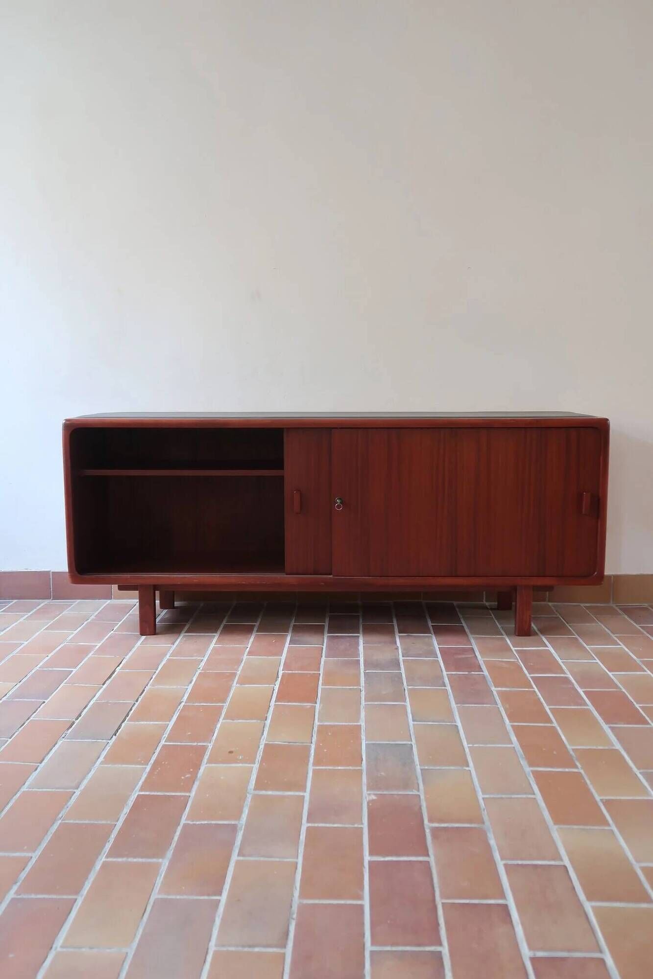 Teak enfilade, sliding doors, black faux leather top, 1970s.