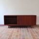 Teak enfilade, sliding doors, black faux leather top, 1970s.