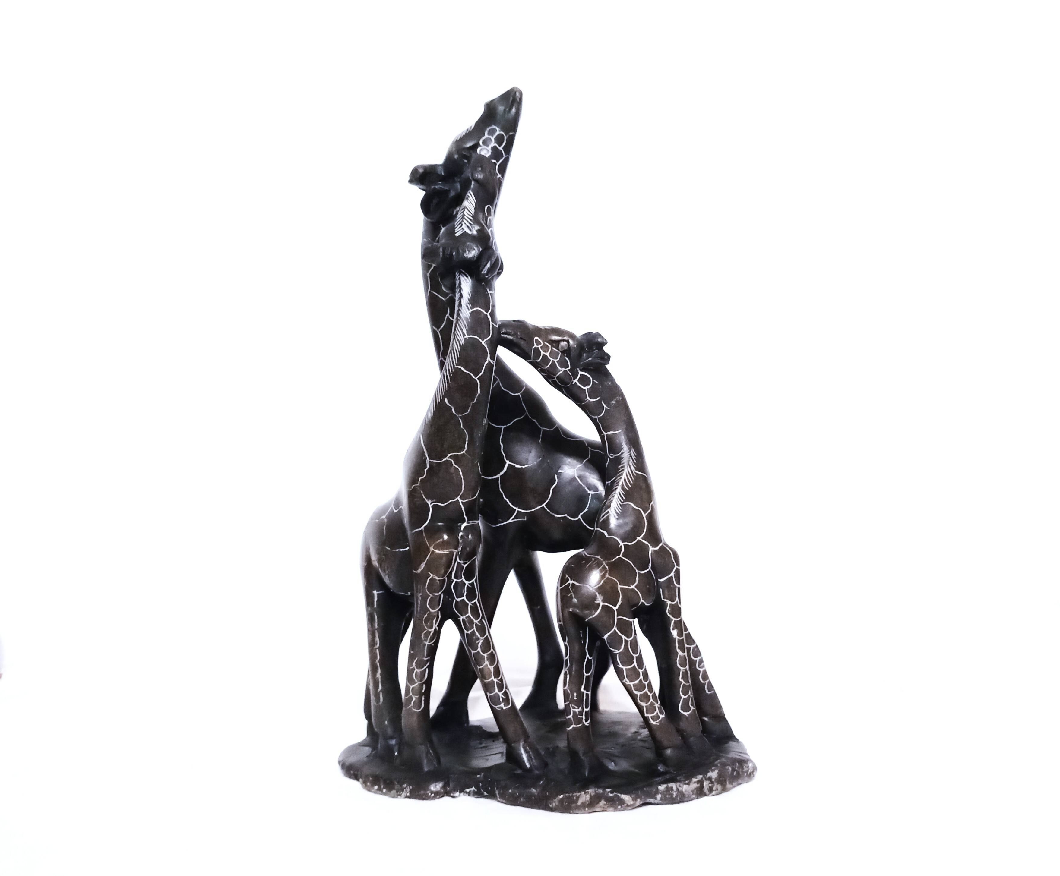 African stone sculpture of 3 Giraffes