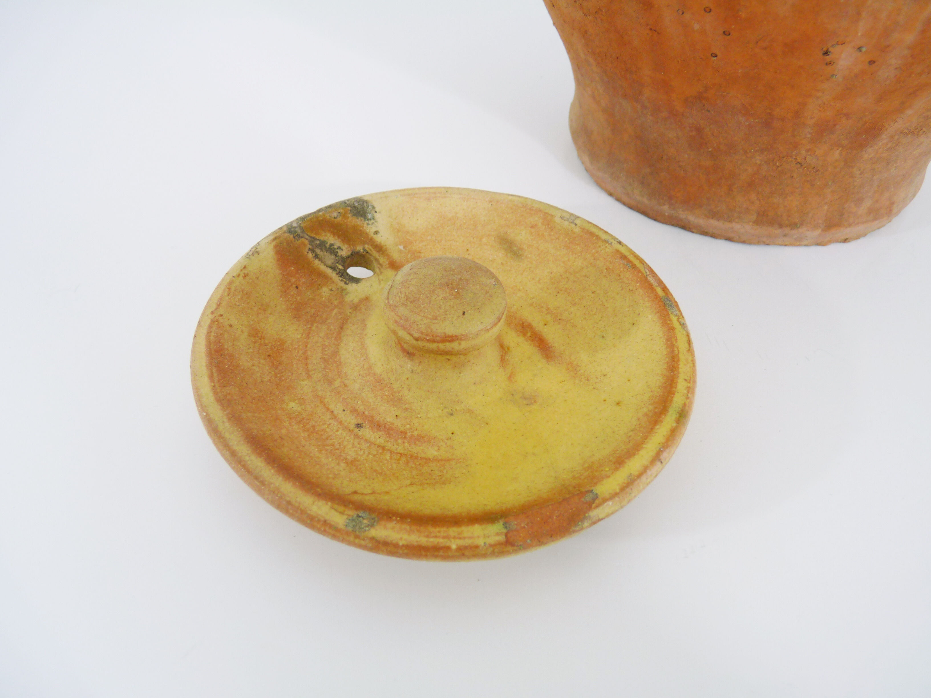 Old jug, chevrette, water pitcher in glazed yellow sandstone. Early twentieth century