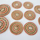 Set of coasters and bottles in colored wicker