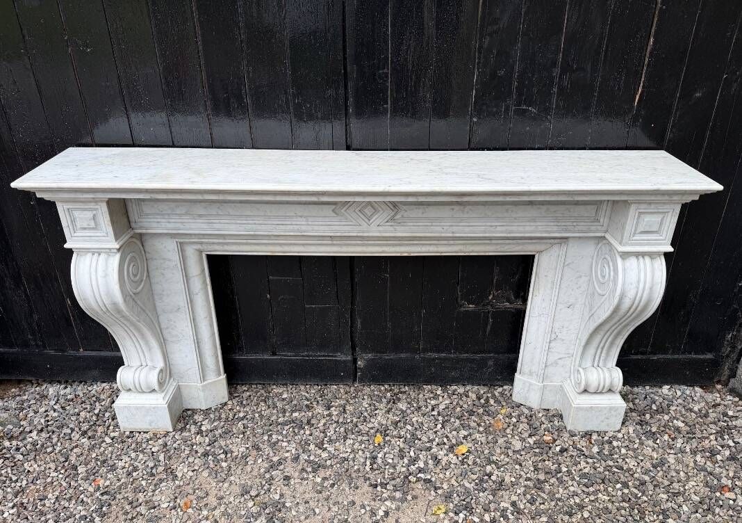 Large Charles X fireplace in white Carrara marble, 19th century.