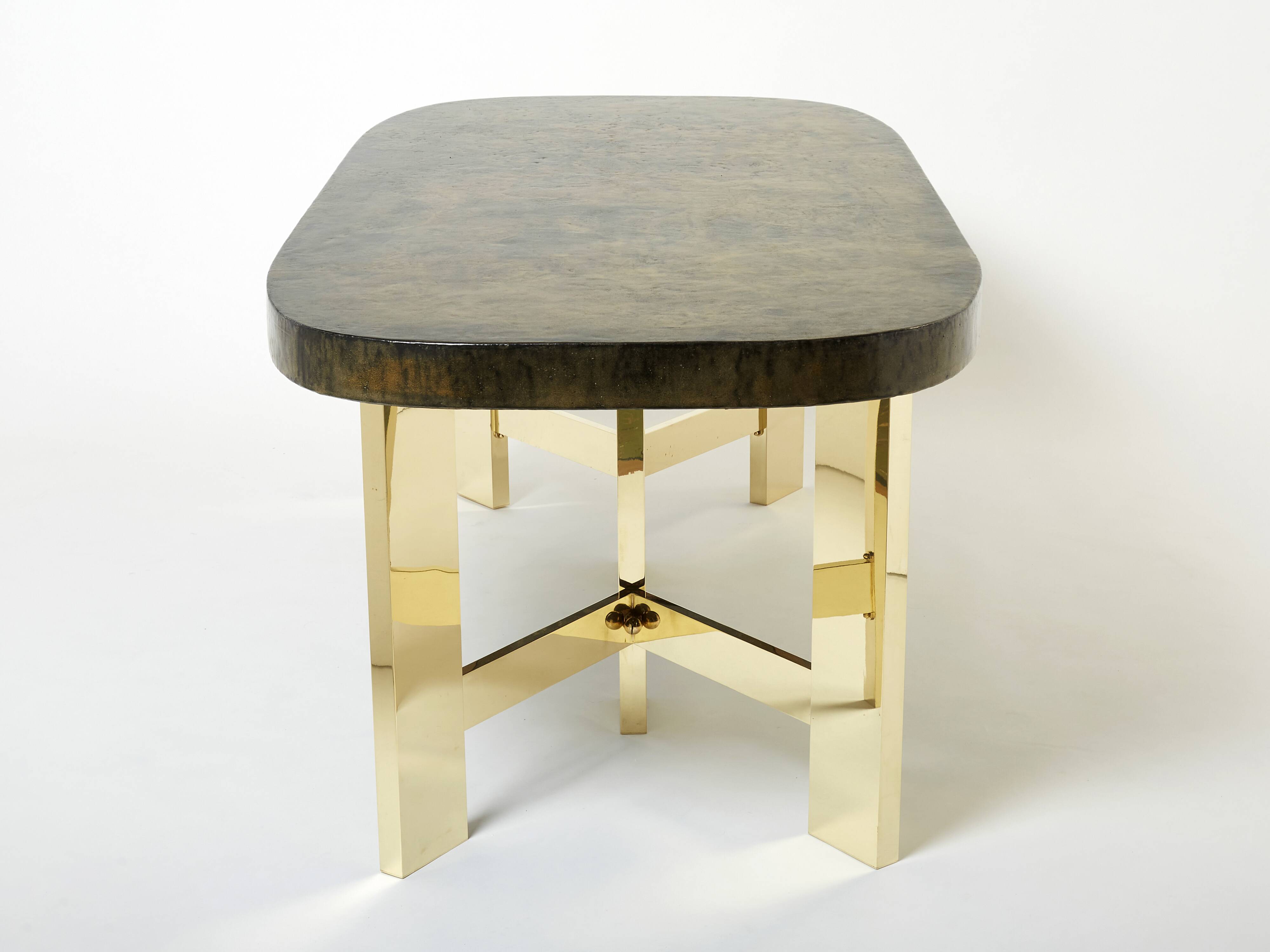 Brutalist Belgian dining table in resin and brass from around 1970.