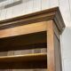 Library in walnut and oak from the early 20th century with its central clock.