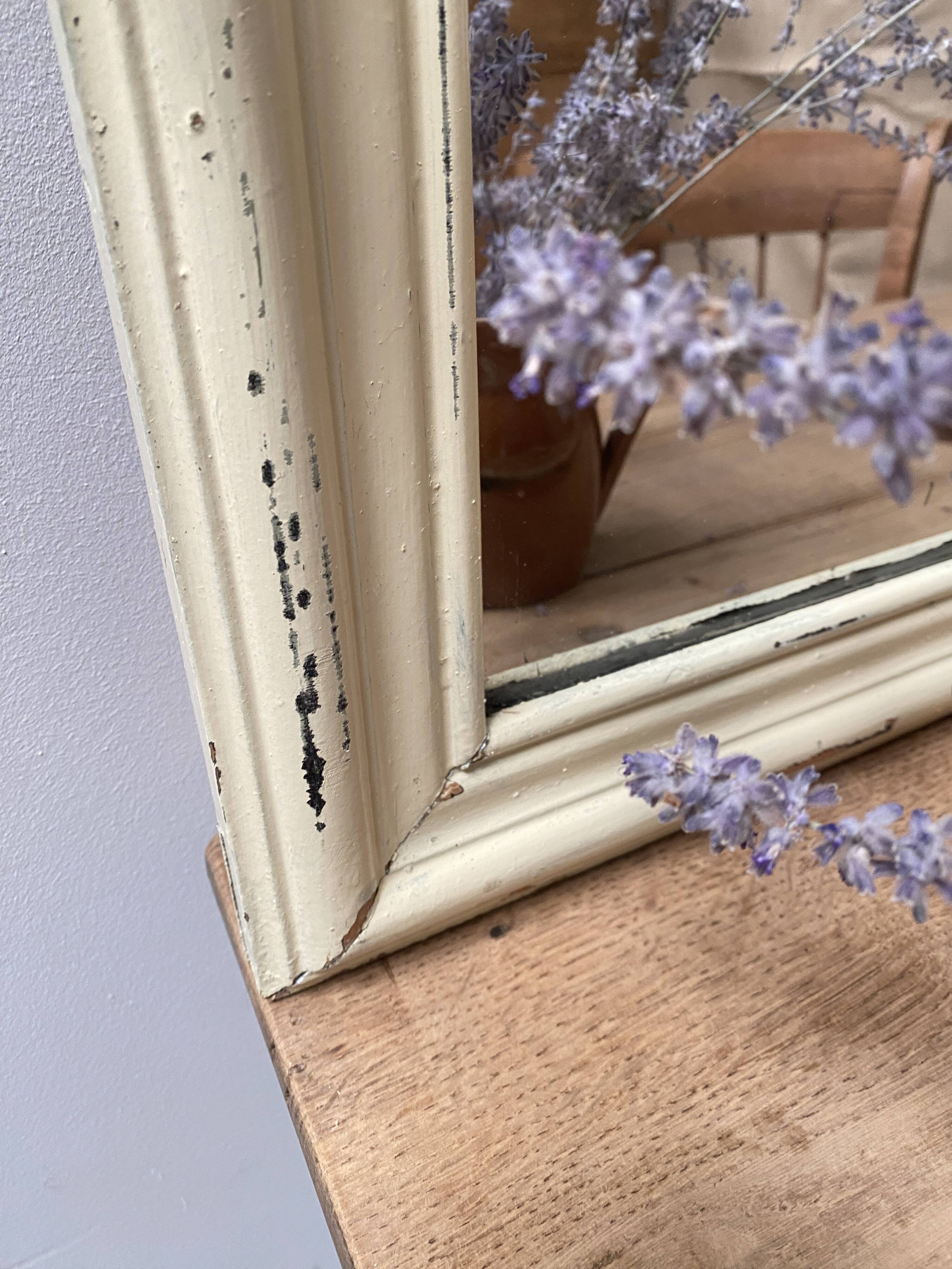 Antique mirror with beige patina