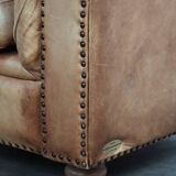 Chesterfield armchair made of cowhide leather in a light cognac colour