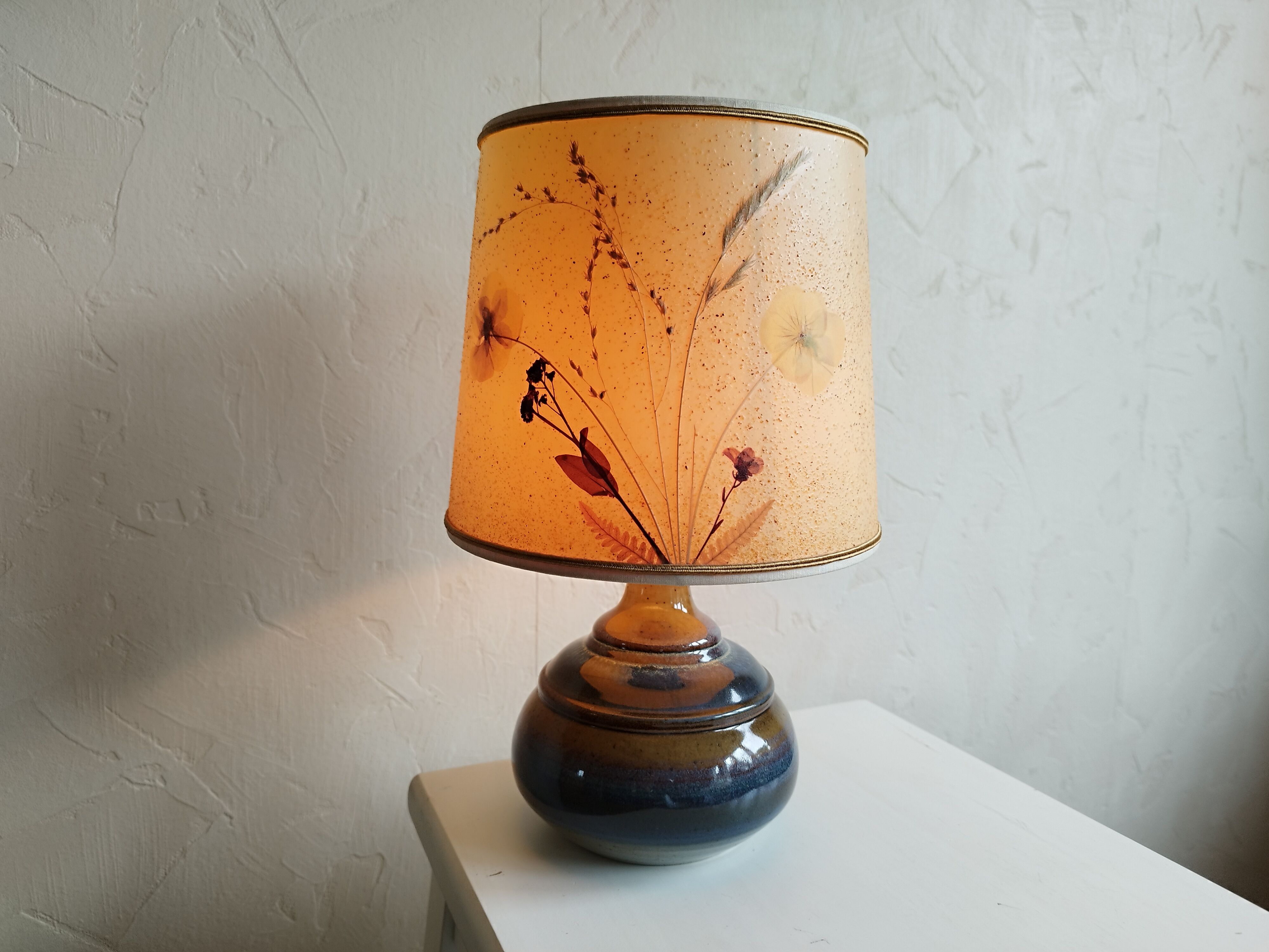 Sandstone lamp and dried flowers