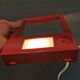 Red danish make up mirror with light and power plug from the 1970