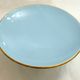 Art Deco modernist coupe, with a base of 3 spheres, in turquoise ceramic and gilding.