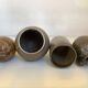 Eight brown ceramic pitcher vases