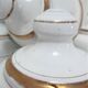 Four white enamelled metal cheese bells early twentieth century