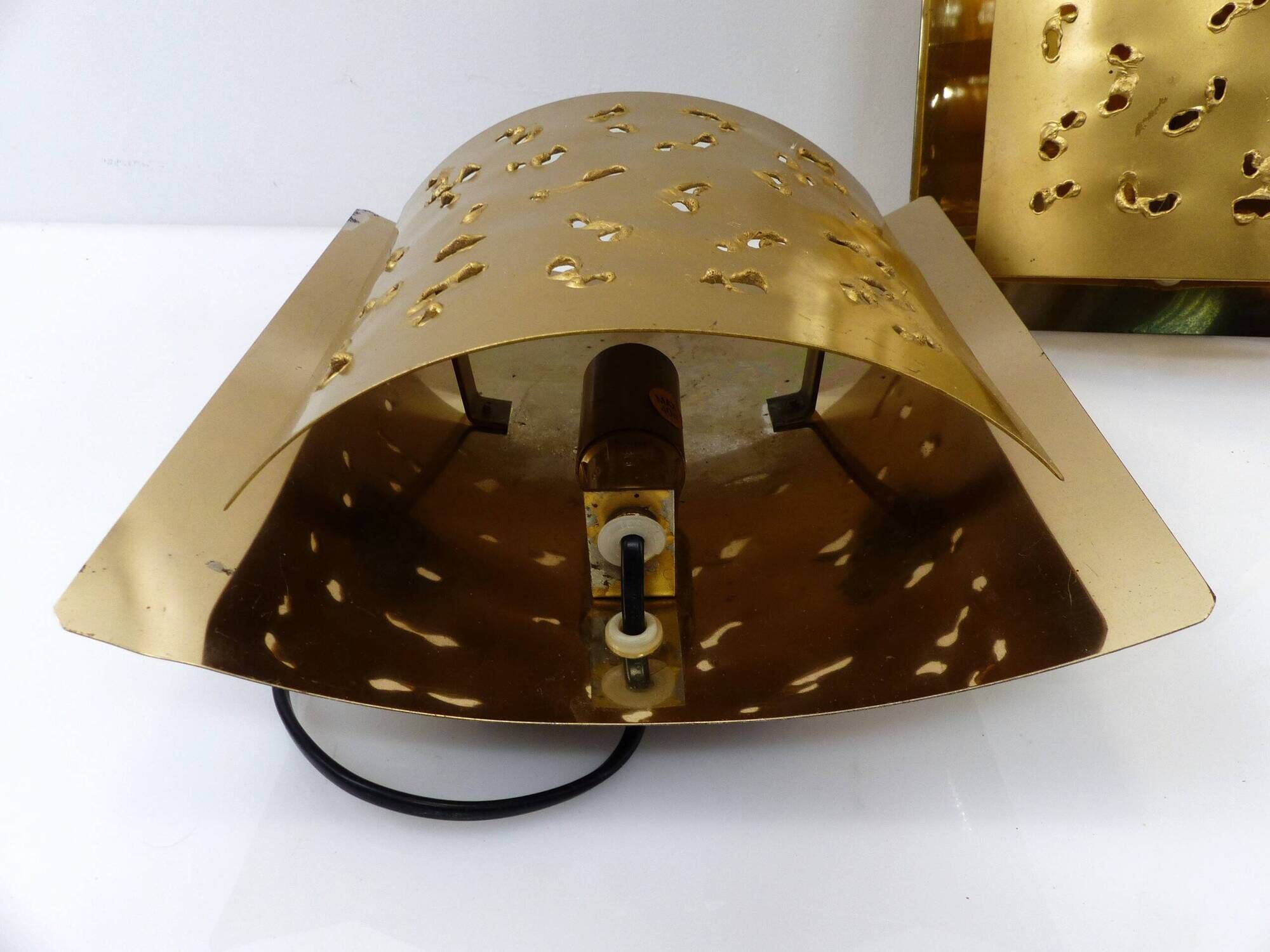 Pair of brutalist wall lights Boréns model 6477 in perforated brass – Sweden
