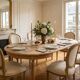 Extendable round table in renovated Louis XVI style, made of light wood, with 2 extensions.