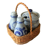 1960s old german ceramic cruet set on a wood and wicker tray, vintage
