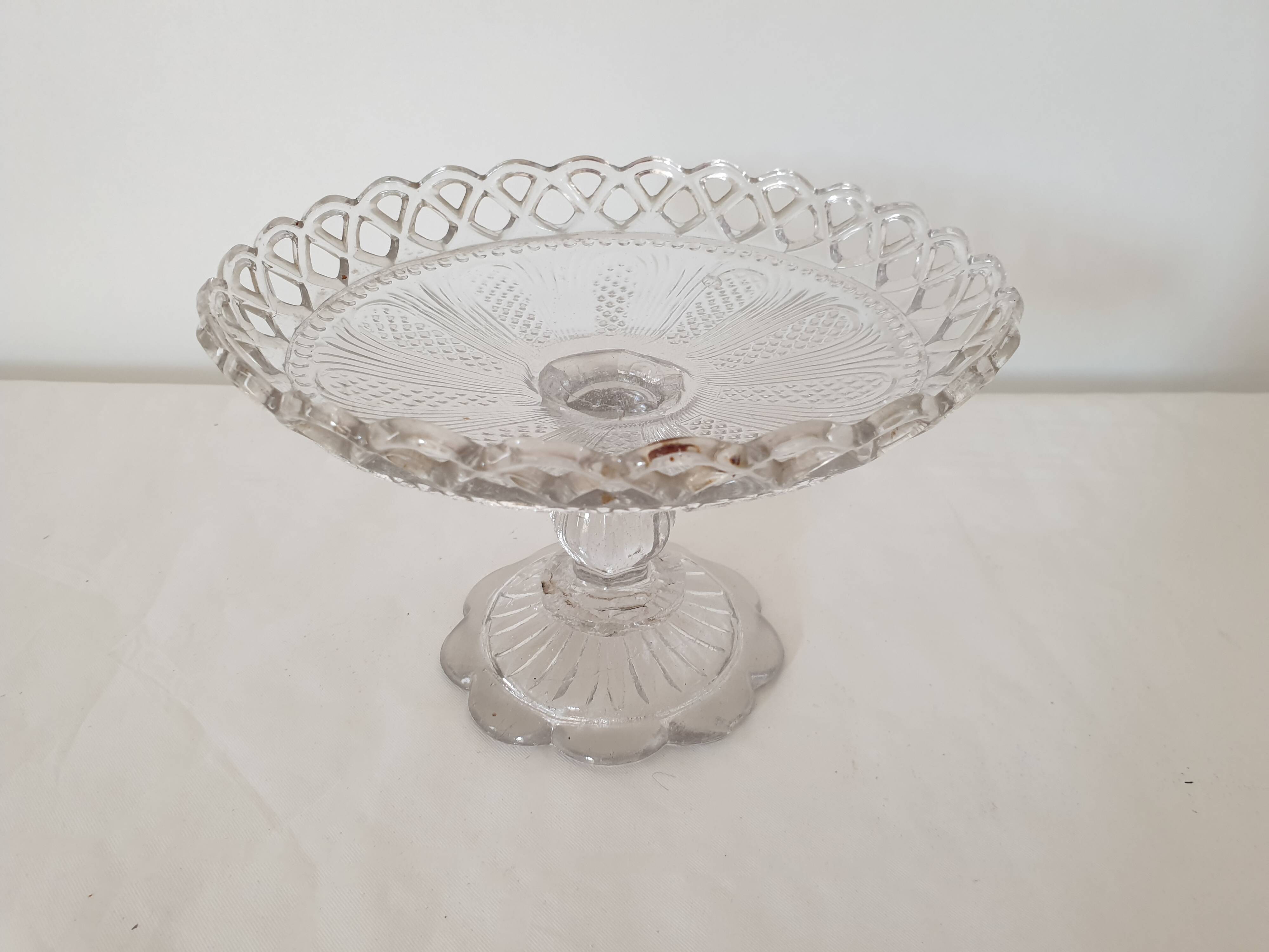 Old cup in molded glass colorless decorative table mignardises