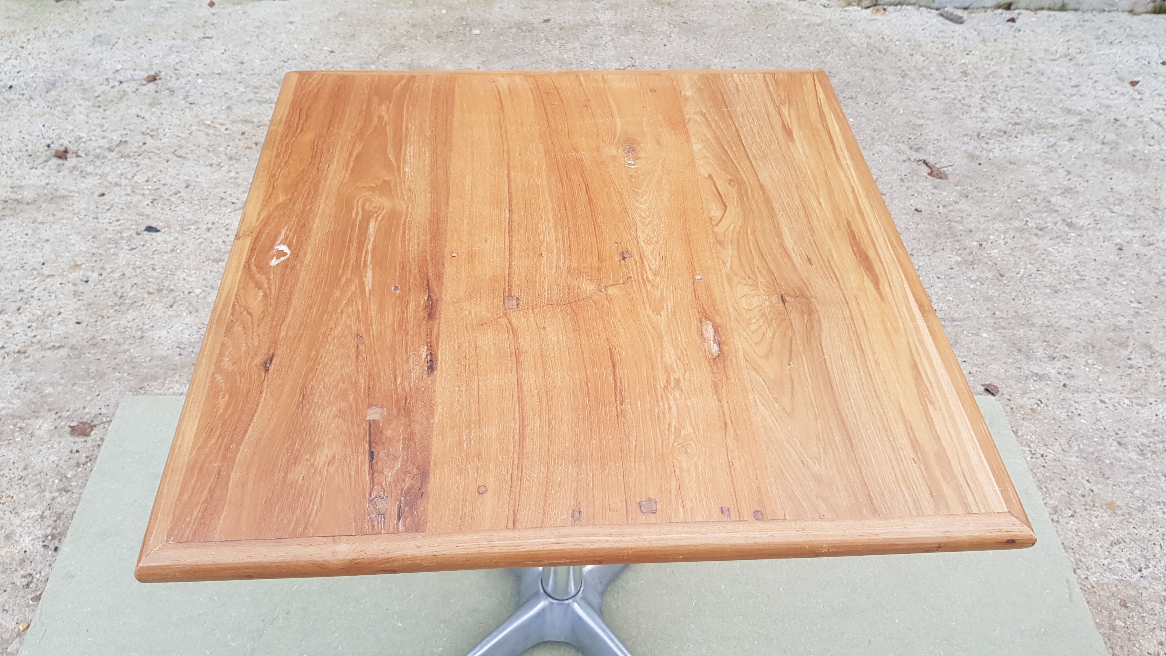 Foldable bistro table with teak top and aluminum base