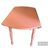 Round wooden table with folding sides