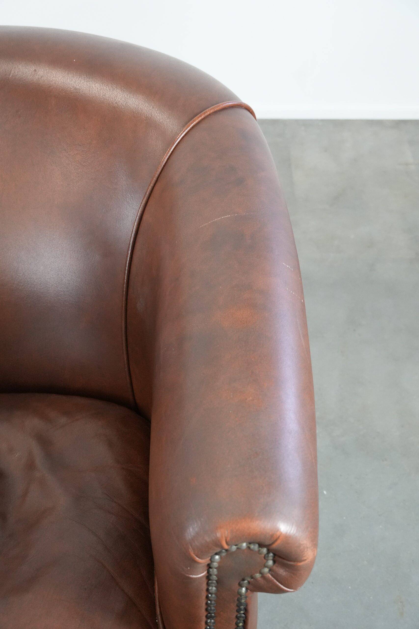 Unique set of two cognac-coloured cow leather club armchairs