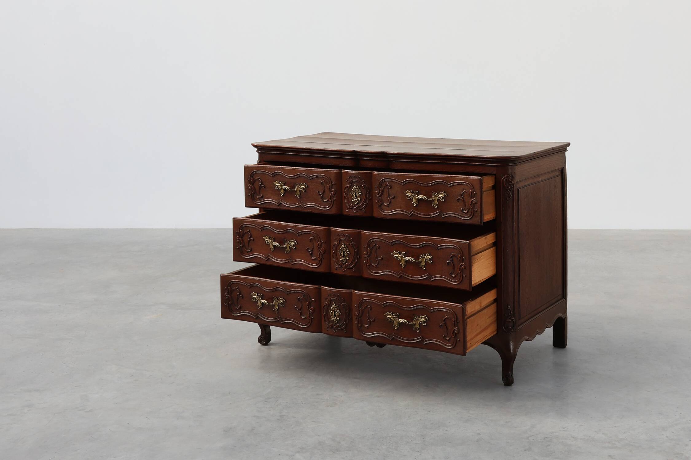 French 18th Century hand crafted oak chest of drawers in Louis XV style