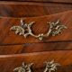 Curved Regency-style commode in mahogany marquetry.