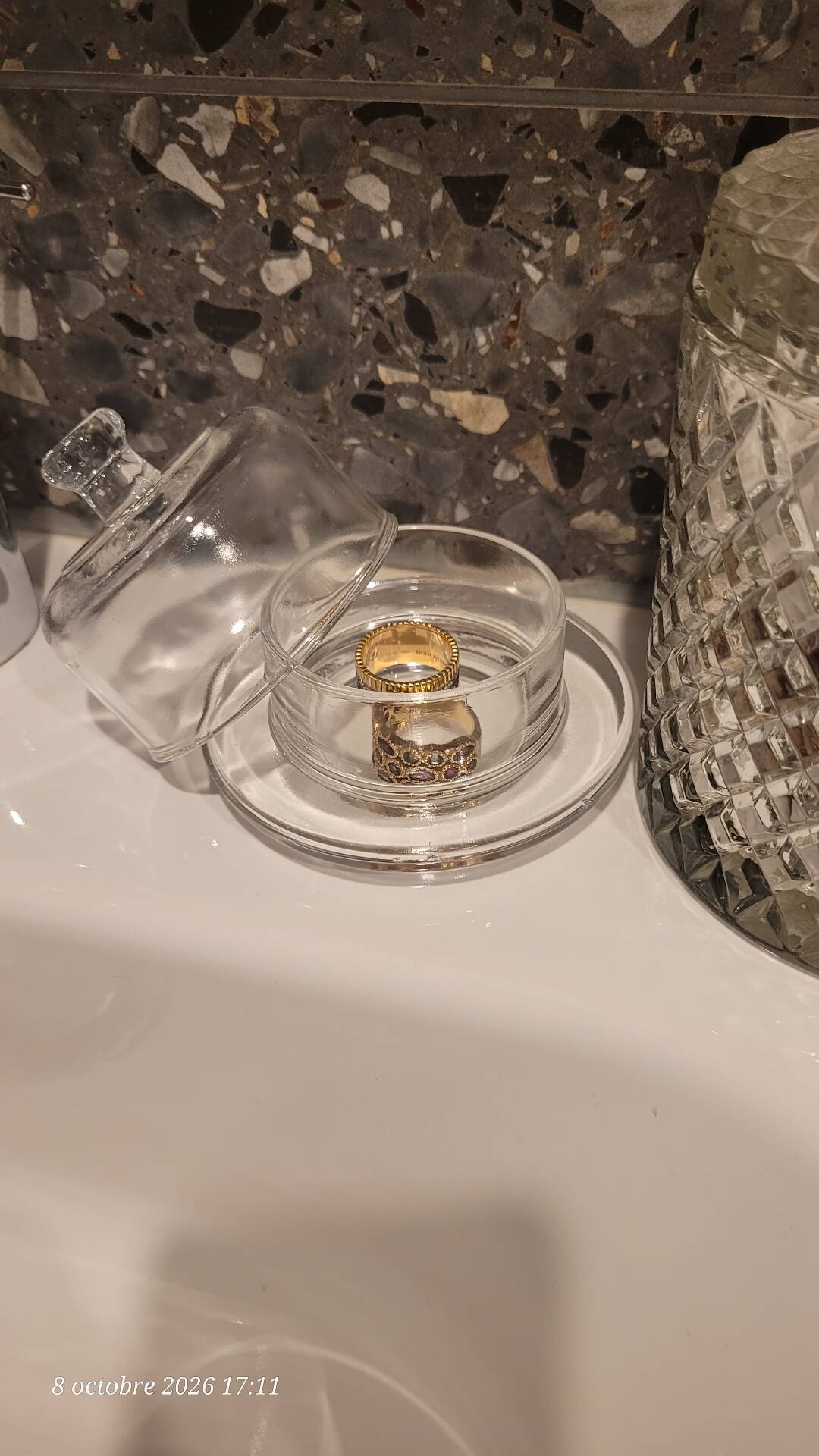 2 transparent glass butter dishes accompanied by their matching cloches.