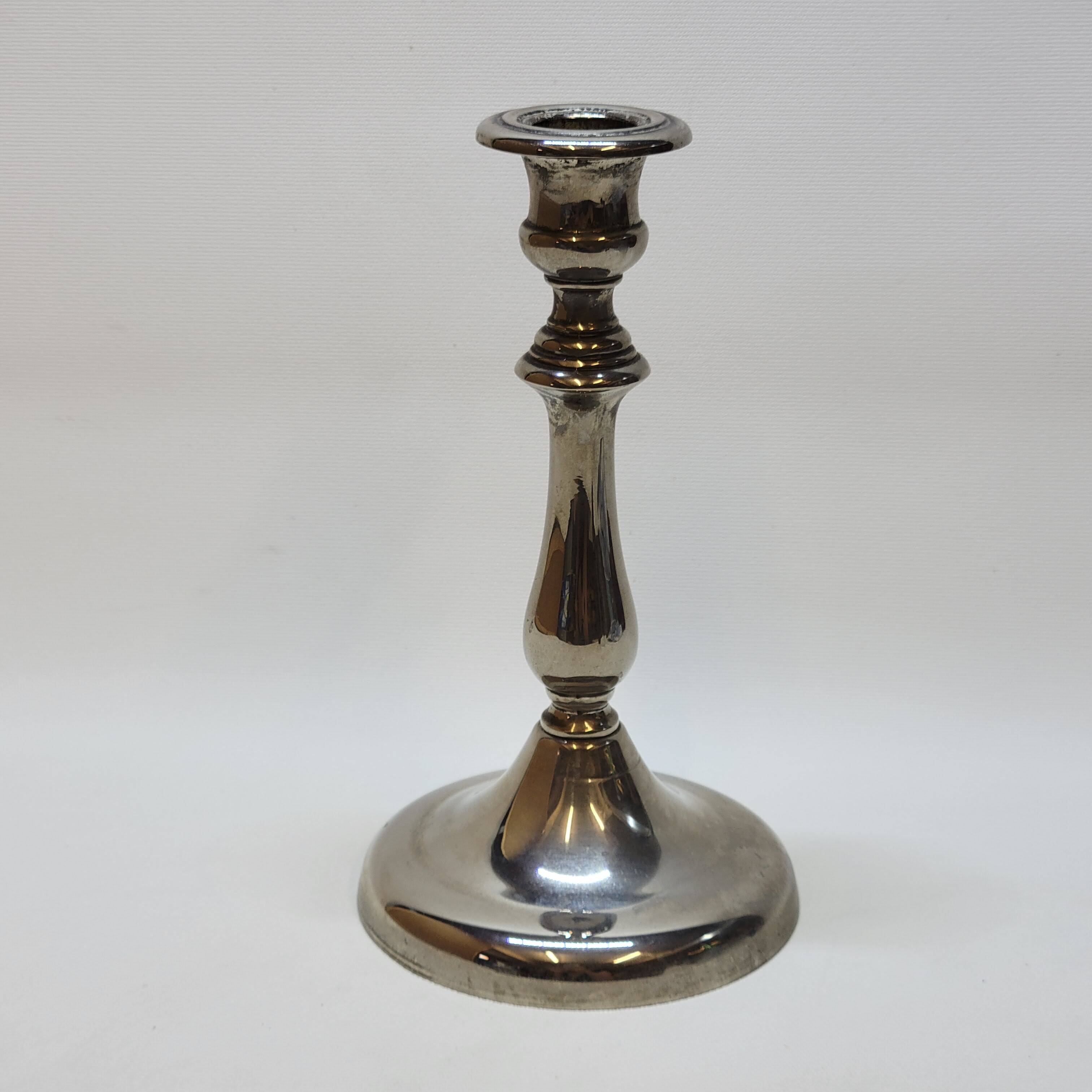 Old candle holder in silver metal