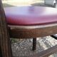 Set of 19 vintage wooden bistro chairs with red faux leather.
