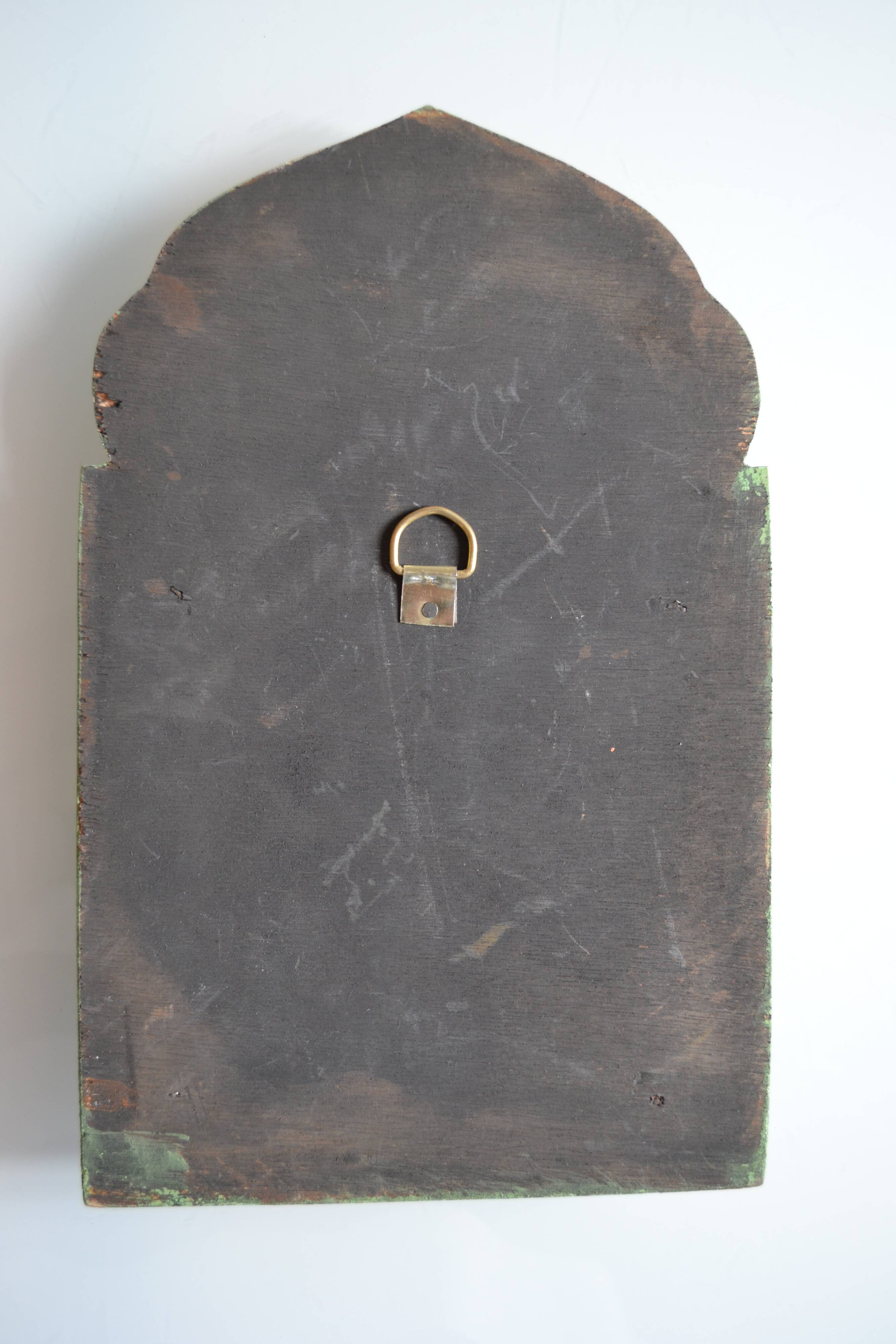 Mirror under shutters with painted flower decoration
