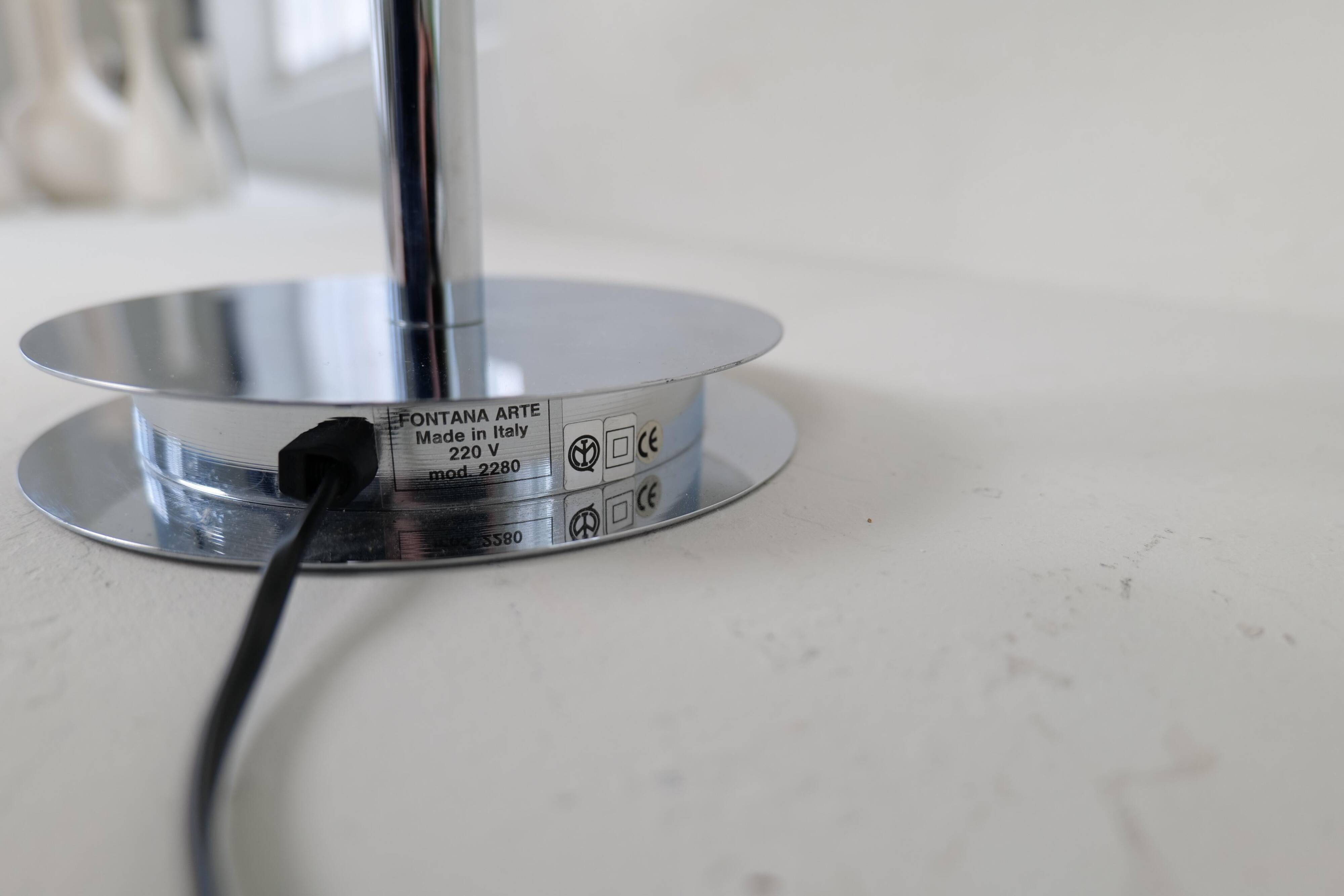 "Tris" glass table lamp by Fontana Arte from the Space Age with a chrome base, Italy, circa 2000.