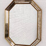 Octagonal mirror in Venetian style with gold-rimmed parecloses